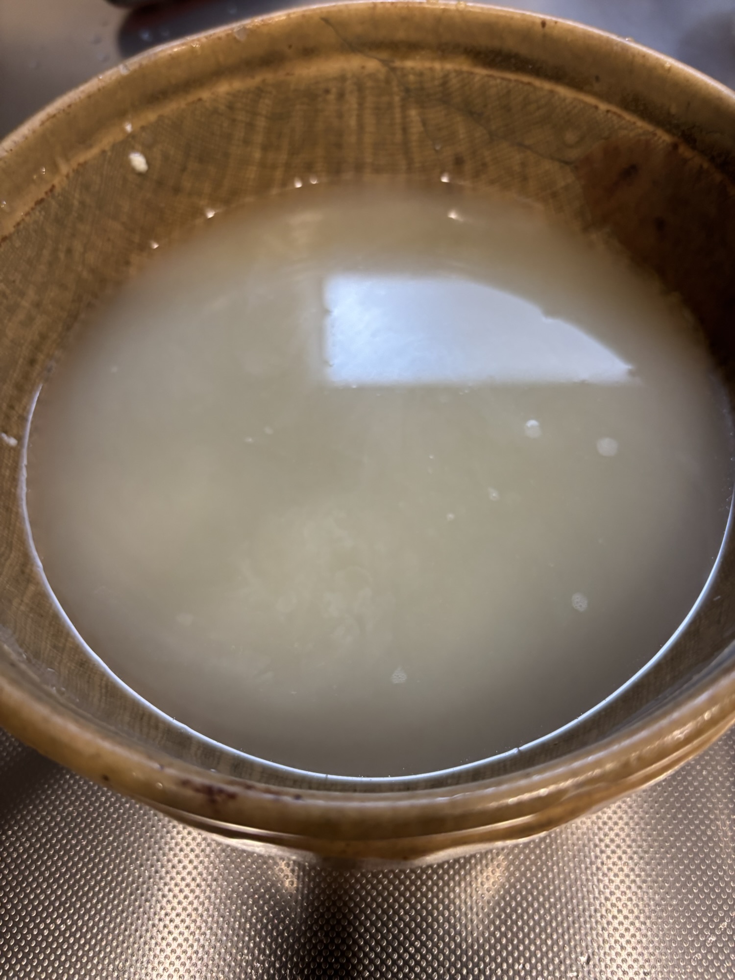 The water squeezed from the tofu